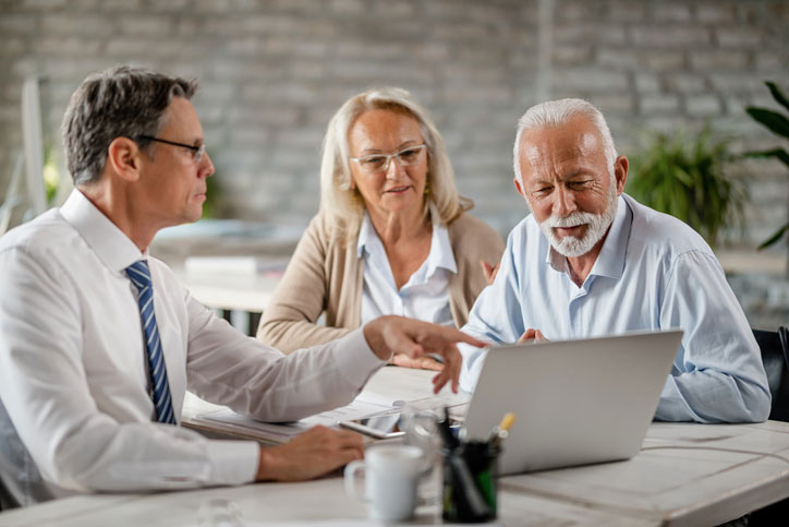 mature couple meeting with accountant