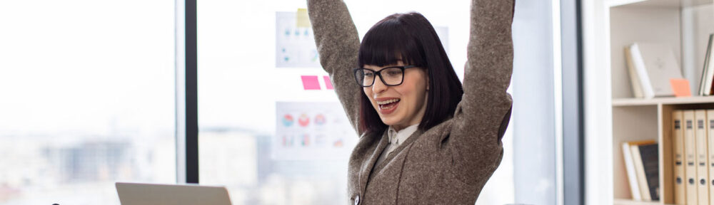 celebrating-exam-pass - CPA 2025 Requirements by State | CPA Exam and Accountant Education woman celebrating exam pass