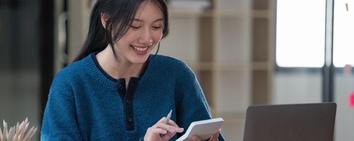 - CPA 2025 Requirements by State | CPA Exam and Accountant Education Female accounting student smiling while reviewing notes on tablet, sitting at desk with laptop and office supplies in modern study space